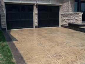 Coloured stamped concrete driveway with border Hamilton ON