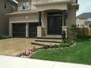 Coloured stamped concrete driveway with border Hamilton ON