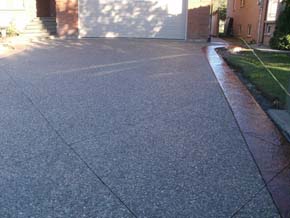 Exposed aggregate driveway with coloured stamped concrete border Hamilton ON