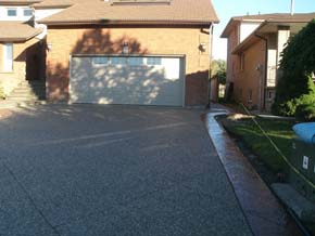 Exposed aggregate driveway with coloured stamped concrete border Hamilton ON