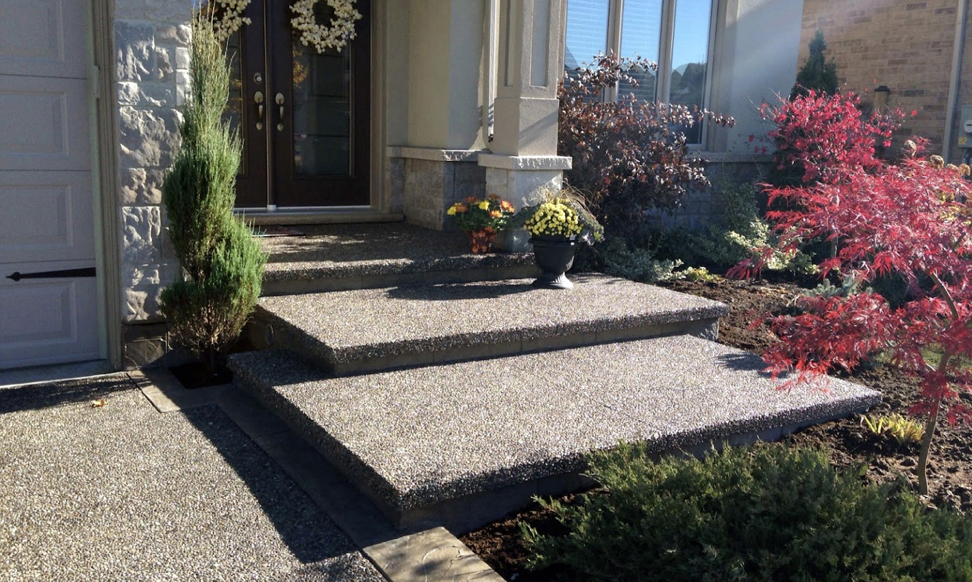 Exposed aggregate steps and driveway with border Hamilton ON