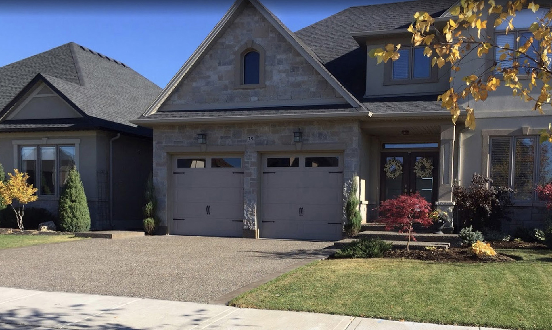 Exposed aggregate driveway with border and steps Hamilton ON